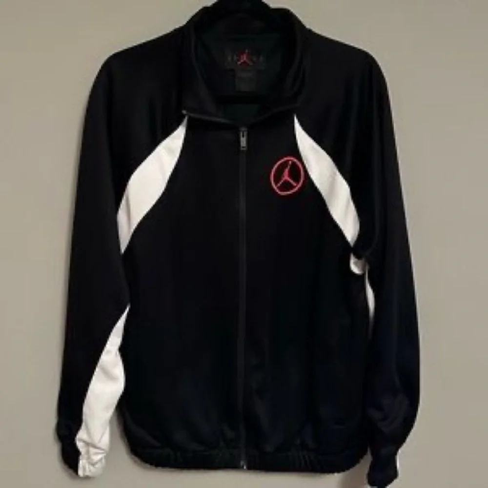 Jordan Black and White Performance Track Jacket with Red Logo